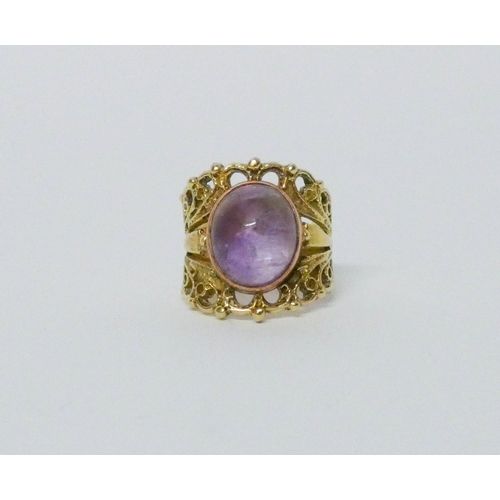 624 - Handmade yellow metal and amethyst ladies dress ring, ring size L