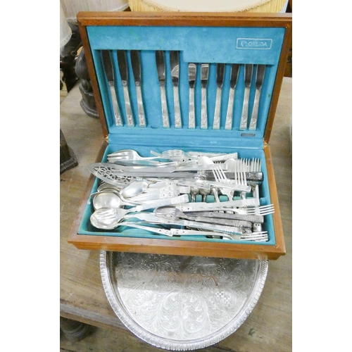 106 - A canteen of plated cutlery and an oval plated tray