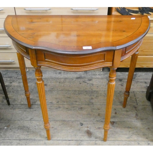 32 - A shaped fronted yew wood hall table