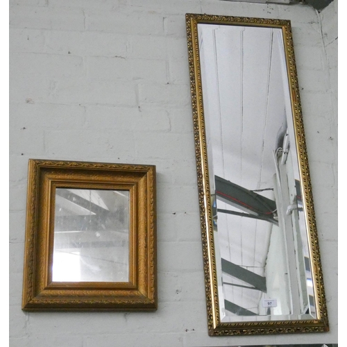 97 - A bevelled edge gilt framed dressing mirror and a smaller panel wall mirror