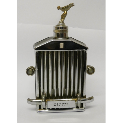 509 - Novelty Rolls Royce drinks decanter with Sprit of Ecstasy finial, with musical movement to the base