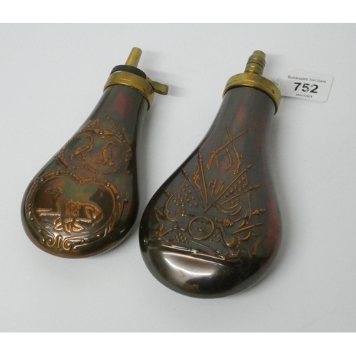752 - Two antique style embossed copper powder flasks