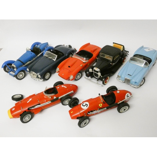 67 - A collection of seven Burago tinplate model sports cars and racing cars etc