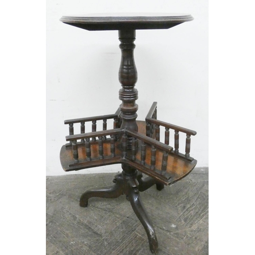 144 - A late Victorian mahogany wine table with book shelf under on tripod base