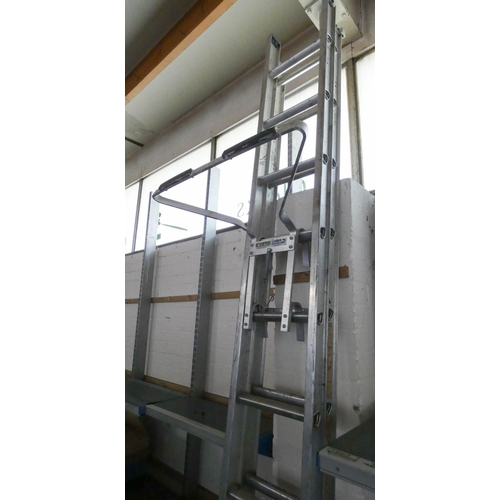 386 - An 11 rung aluminium extending ladder & stand-off