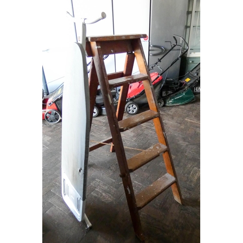 388 - An ironing board and a wooden step ladder