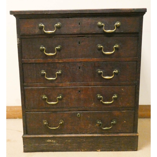 220 - An antique oak chest of five long drawers with brass handles, top drawer fitted with compartments. 3... 