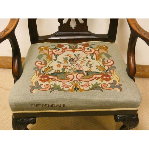 249 - A Chippendale style mahogany open arm chair with embroidered seat panel