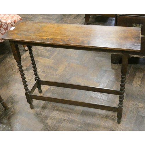 219 - A 1920's oak hall or side table on barley twist legs