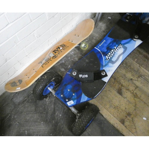886 - A large silver reef four wheel windboard and a 'Team of Explorers' new skateboard