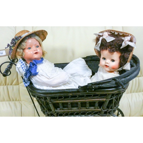 782 - A vintage style dolls pram and two old English dollies