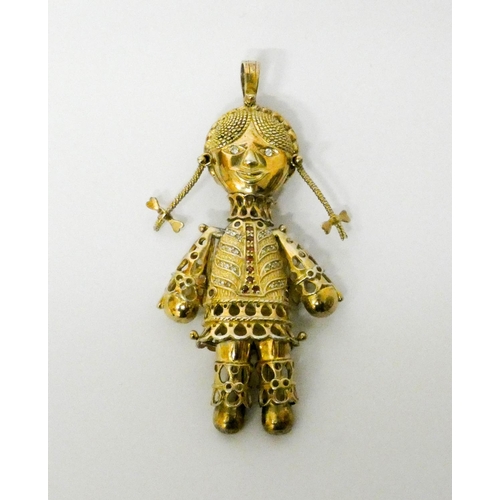 689 - Large silver gilt articulated rag doll pendant, set with red and white stones. 9.5 cms long
