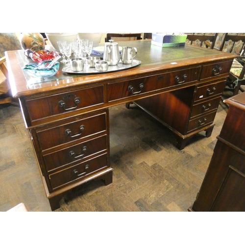 364 - A Georgian style mahogany twin pedestal office desk fitted nine drawers with green inset leather top... 