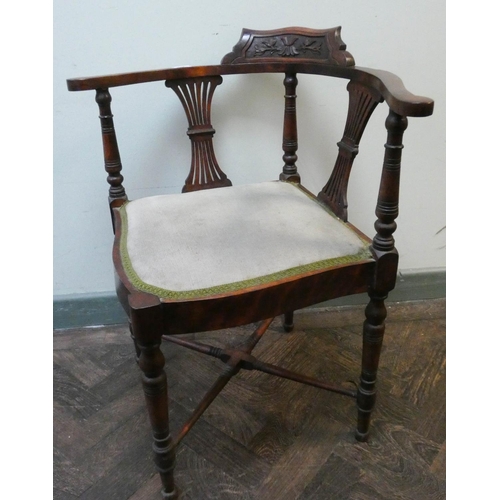 377 - An Edwardian walnut corner elbow chair with green upholstered seat