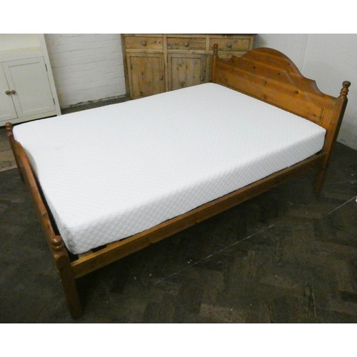 52A - A modern 4'6 pine bed frame together with a memory foam mattress