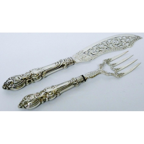 602 - Pair of Victorian silver fish servers, with pierced and engraved decoration, Birmingham 1850, weight...