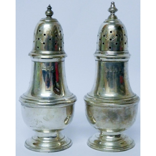 604 - A near pair of modern silver sugar casters, London marks 1963/4.  Weight 8.25 troy ounces...