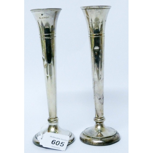 605 - A pair of silver specimen vases, weighted. Height 16 cms approx....