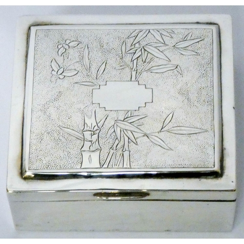 613 - Malaysian silver cigarette box, with bamboo decoration to the hinged lid, marked on base. 9.5 cms ac...