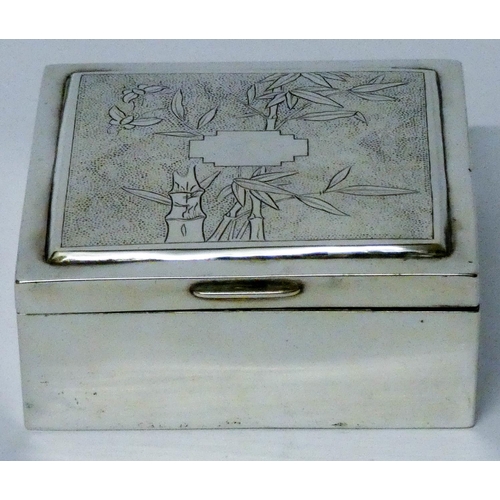 613 - Malaysian silver cigarette box, with bamboo decoration to the hinged lid, marked on base. 9.5 cms ac...