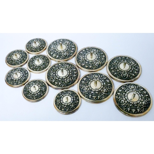 619 - A set of 12 Chinese white metal embossed dish or pot lids, all marked 925 MD, six size 11 cms diamet...