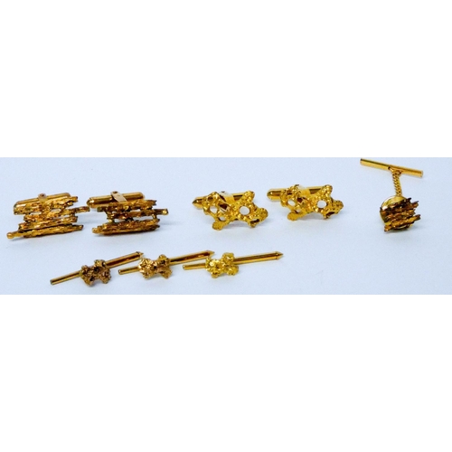 652 - Two Chinese yellow gold nugget effect cufflinks and shirt stud sets, Hallmarked LC K14, in silk purs...