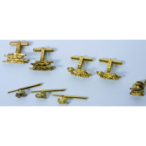 652 - Two Chinese yellow gold nugget effect cufflinks and shirt stud sets, Hallmarked LC K14, in silk purs...