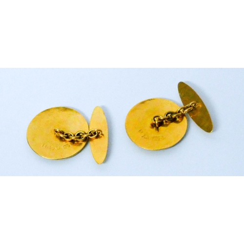 653 - A pair of Chinese yellow high carat gold circular cufflinks. With character marks. Gross weight 11.4...