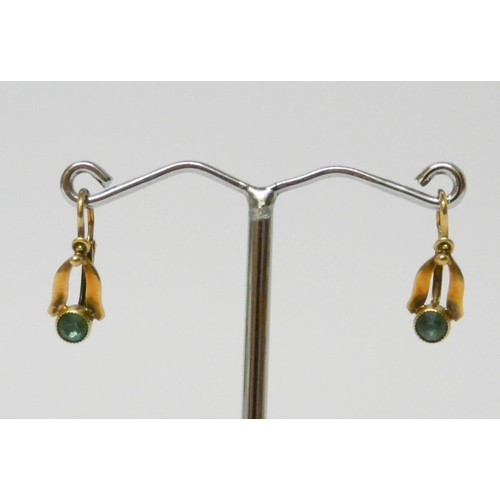 629 - A pair of vintage gold pierced drop earrings set with green stones...