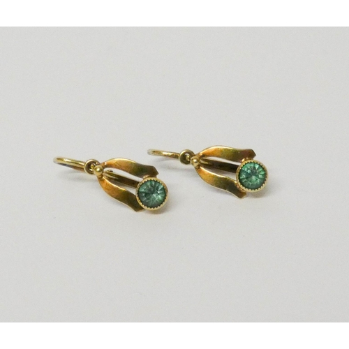 629 - A pair of vintage gold pierced drop earrings set with green stones...