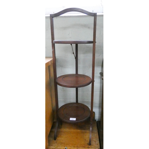 12 - A vintage three tier mahogany folding cake stand