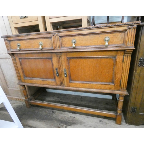 14 - A 1950's oak sideboard fitted two drawers and cupboards, 4' wide...