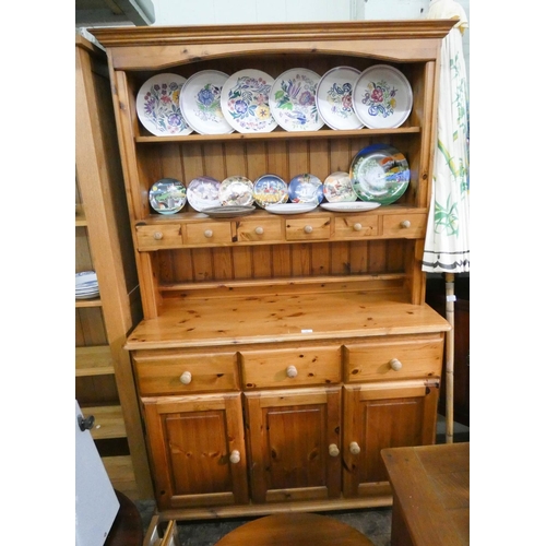 35 - A modern pine dresser with shelf back with spice drawers and drawers and cupboards under, 4' wide...