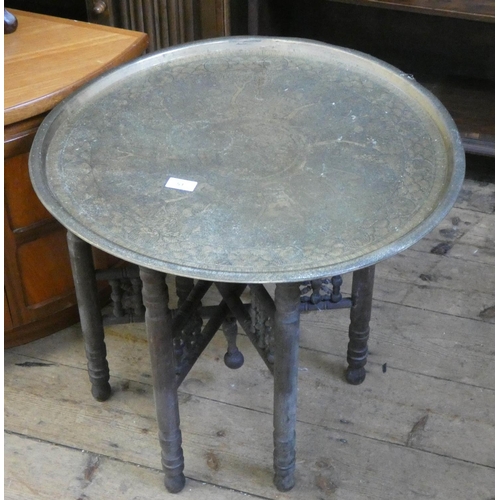 51 - A circular brass tray topped tiffin table on folding stand...