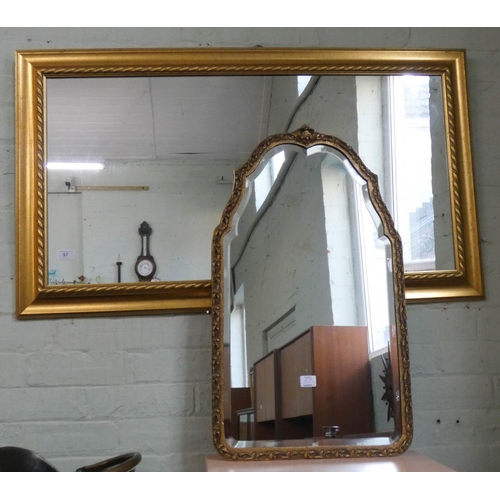 57 - A large wall mirror in gilt frame and a shaped bevelled mirror in decorative gilt frame...