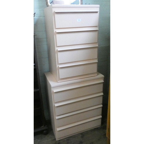 58 - Two small pink painted chests, each fitted four drawers...