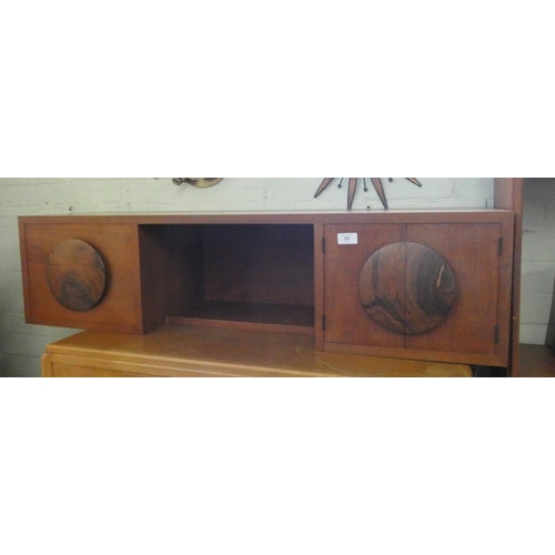 60 - A low teak table top cabinet fitted two drawers and cupboards, 44