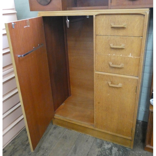 62 - A Gplan light oak combination wardrobe fitted cupboards and drawers, 3' wide