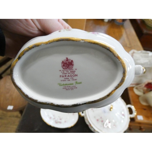 100 - A Paragon bone china Victorian Rose decorated part dinner and tea service