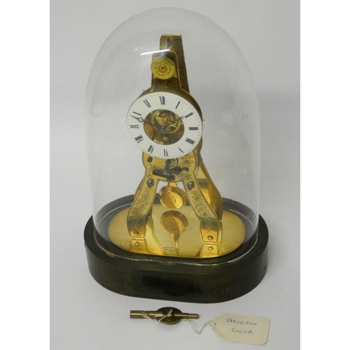 157 - A French 19th century brass skeleton clock beneath a glass dome, inscribed 'Honourables, Paris, Lond... 