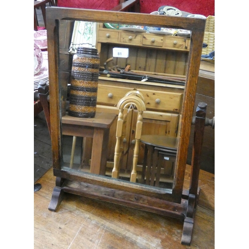 81 - An oak framed swing toilet mirror