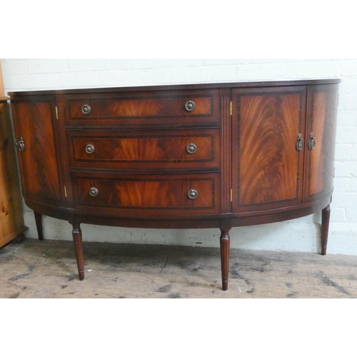 39 - A Georgian style mahogany bow fronted cross banded sideboard fitted three centre drawers and cupboar... 