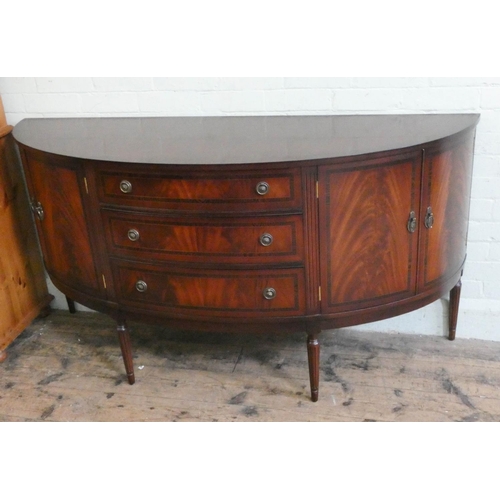 39 - A Georgian style mahogany bow fronted cross banded sideboard fitted three centre drawers and cupboar...