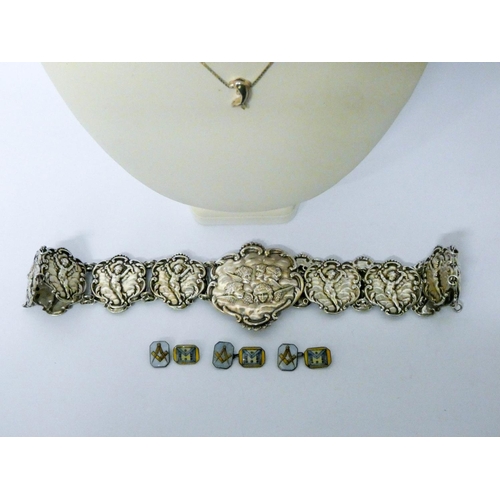 632 - A Victorian white metal belt decorated with Gainsborough cherubs, together with silver necklaces, en...