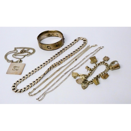 640 - A collection of silver jewellery - heavy neck chains, ingot pendant and hinged bangle etc, gross wei...