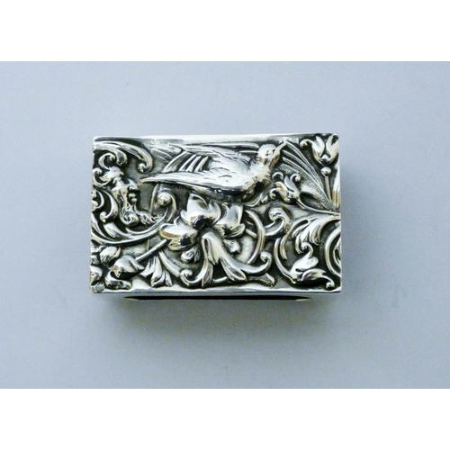 641 - Edwardian silver match box cover, with embossed decoration of a bird amidst foliage, London 1904...