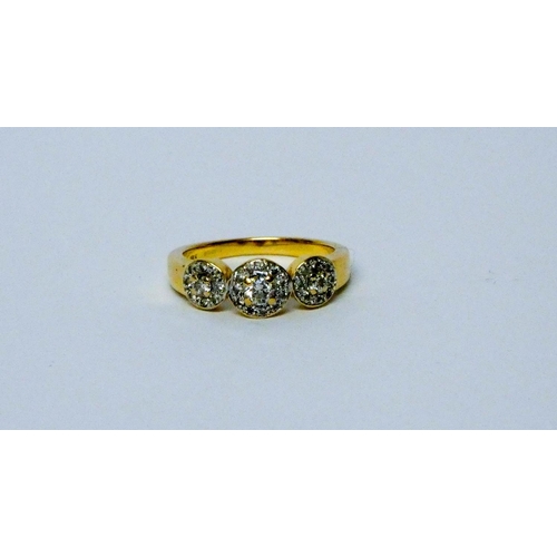 666 - Modern 18ct yellow gold and diamond triple cluster ring, ring size O, weight 5.3 g, hallmarked.