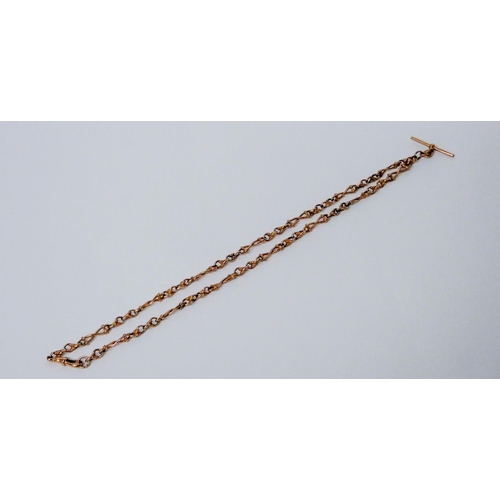 687 - 9ct rose gold watch albert chain, with T bar, gross weight 37 grams. 59 cms long.