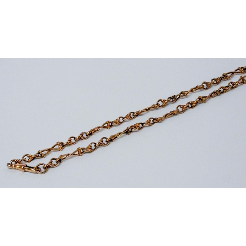 687 - 9ct rose gold watch albert chain, with T bar, gross weight 37 grams. 59 cms long.