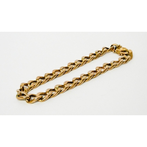 690 - A 9ct gold curb bracelet. 12.8 grams